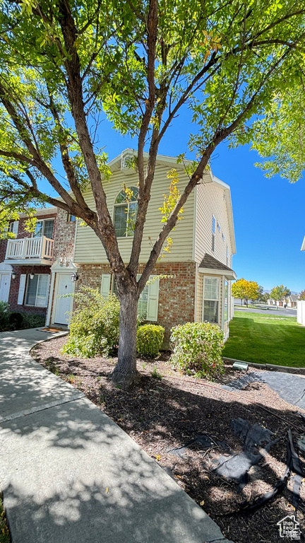 View of front of house with a front yard