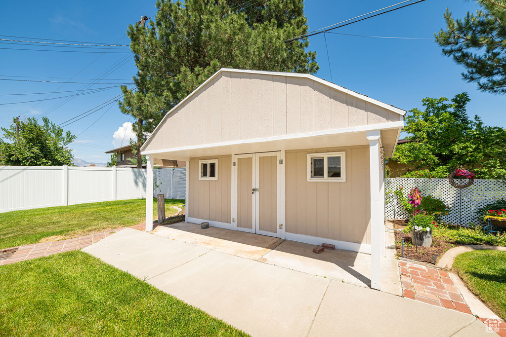 View of outbuilding featuring a fenced backyard