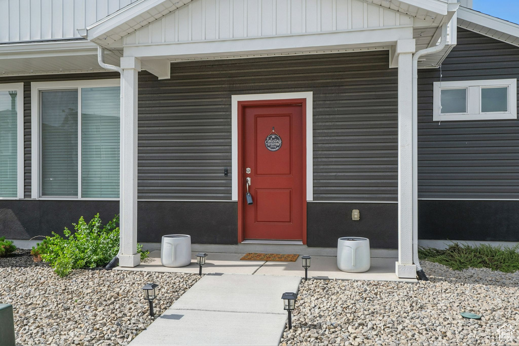 Entrance to property featuring board and batten siding