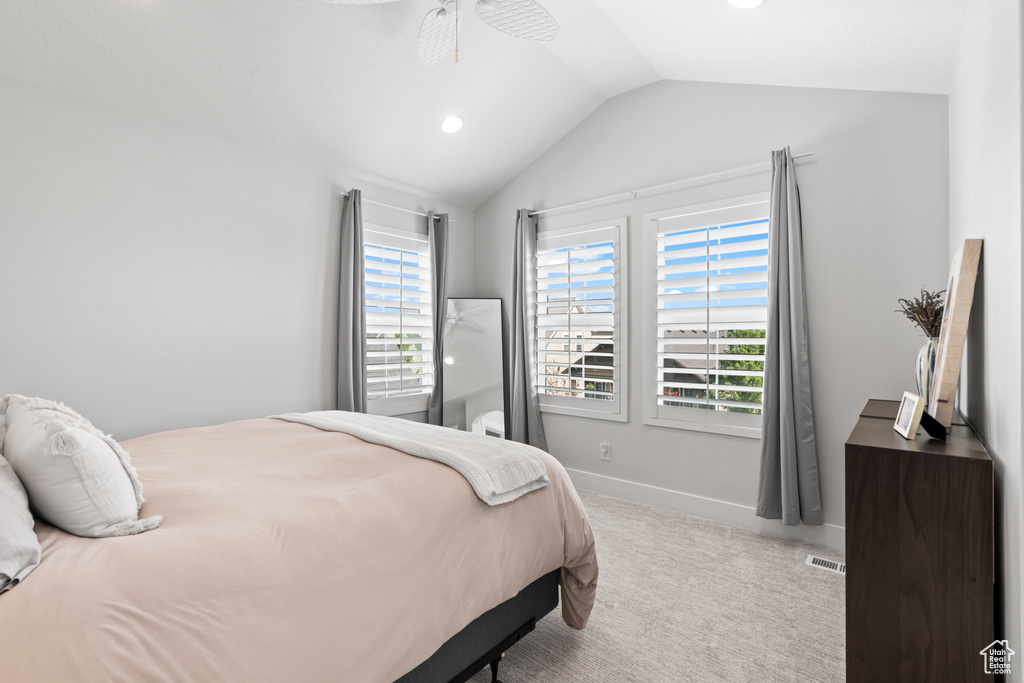 Carpeted bedroom featuring vaulted ceiling, recessed lighting, and ceiling fan