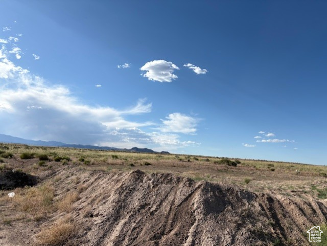 View of mountain backdrop featuring rural landscape
