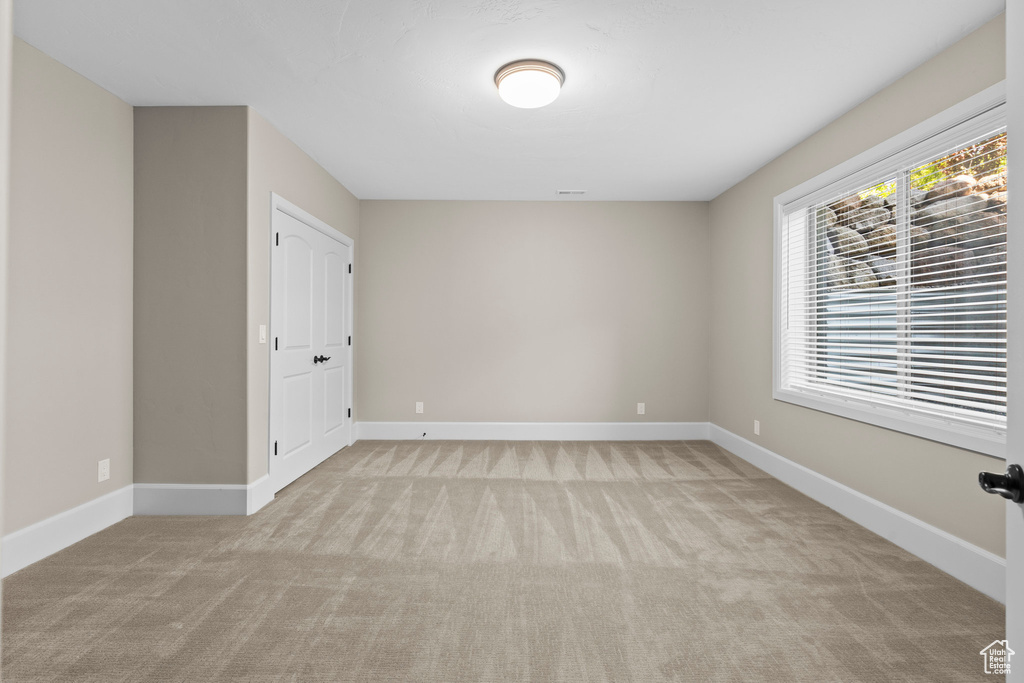 Empty room featuring carpet flooring