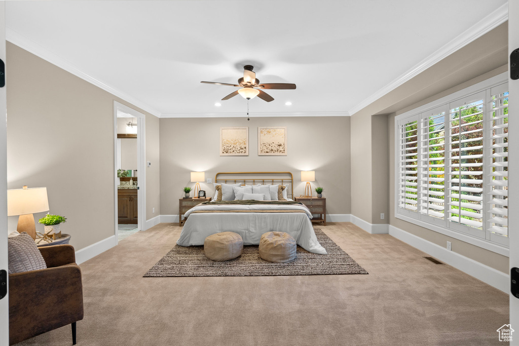 Bedroom with carpet flooring, ornamental molding, ensuite bathroom, recessed lighting, and ceiling fan