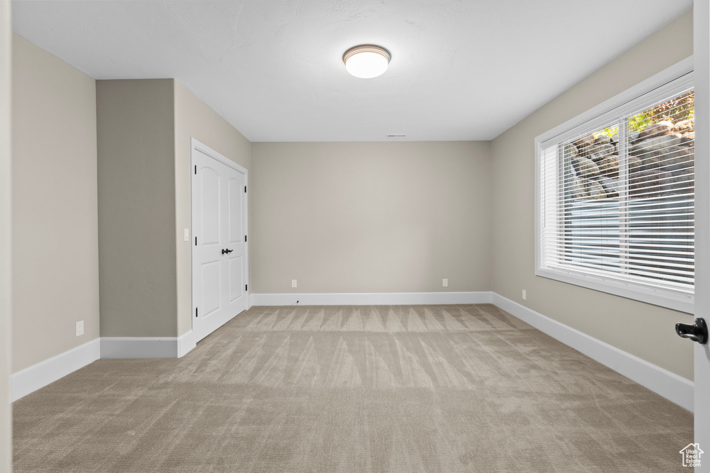 Unfurnished room with carpet flooring