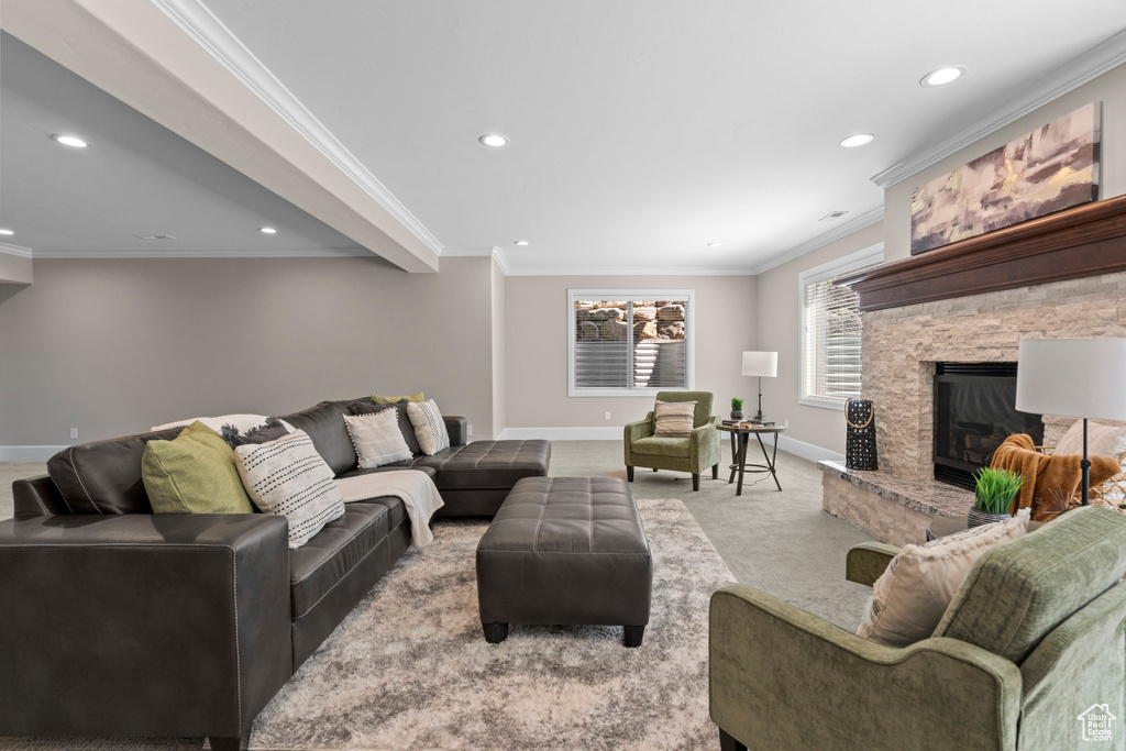 Carpeted living area with recessed lighting, a fireplace, and crown molding