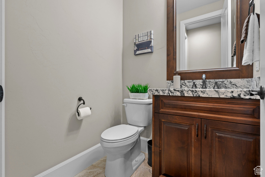 Bathroom with baseboards and vanity