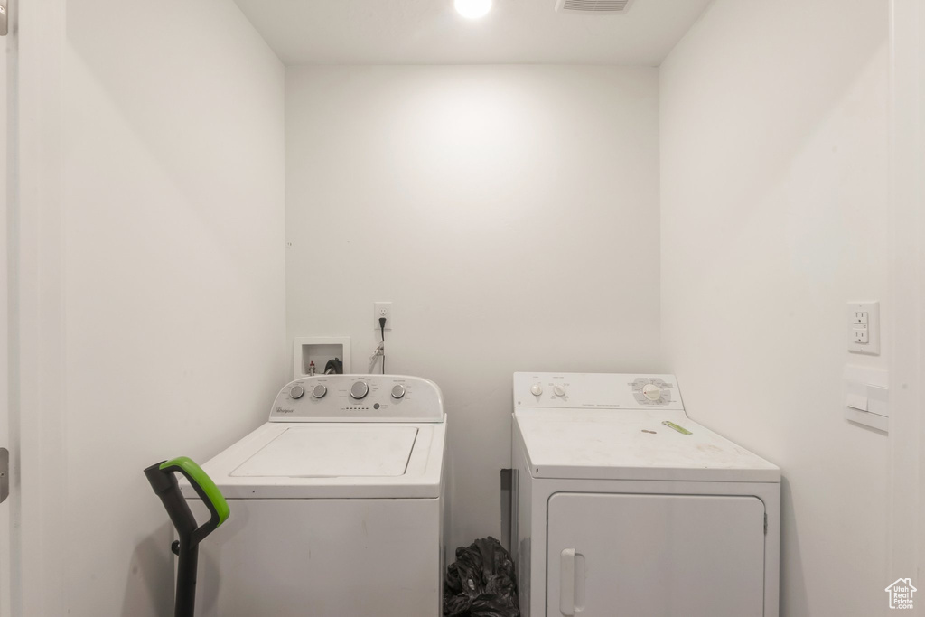 Laundry room with washing machine and clothes dryer