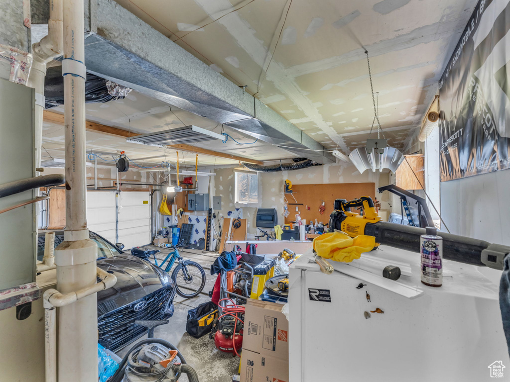 Garage featuring white fridge