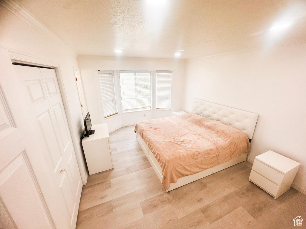 Bedroom with light wood-style flooring