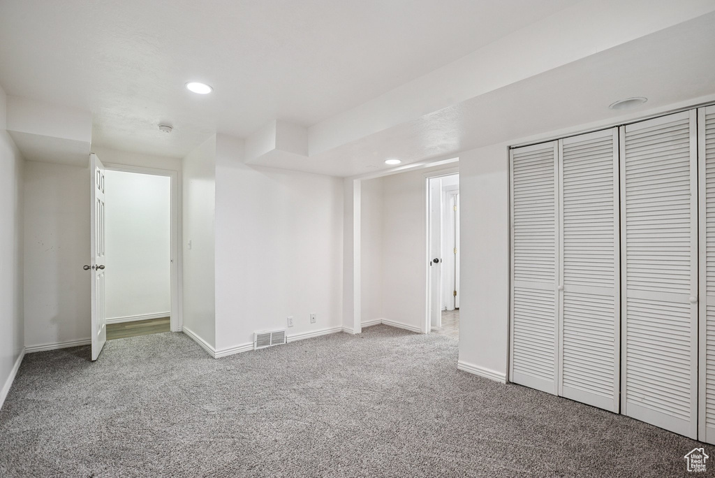 Below grade area featuring carpet flooring and recessed lighting