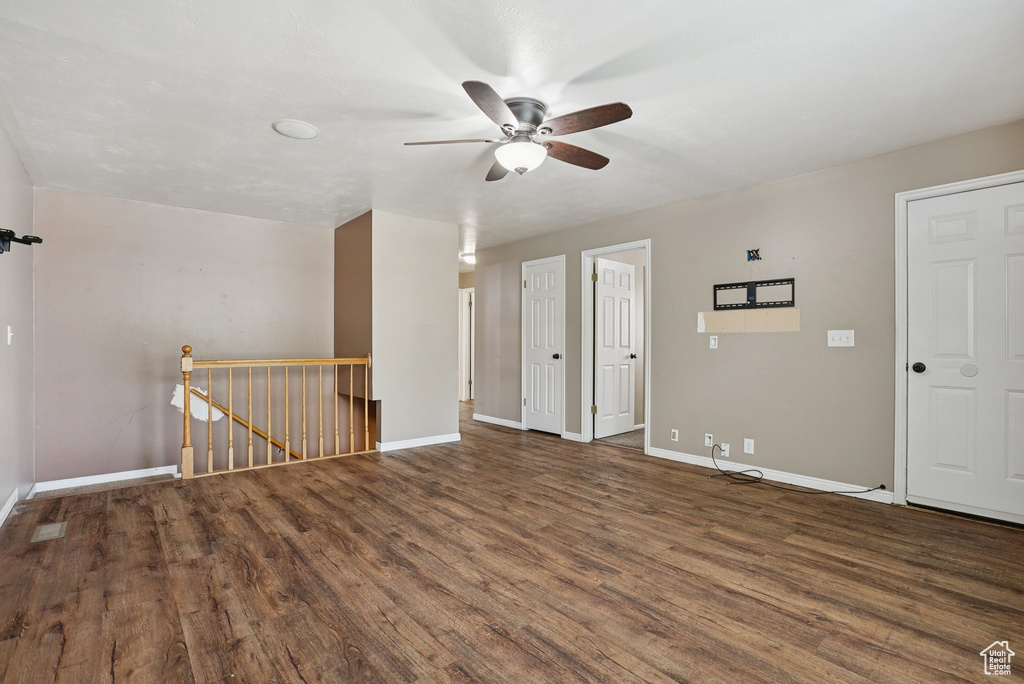 Empty room featuring ceiling fan and wood finished floors