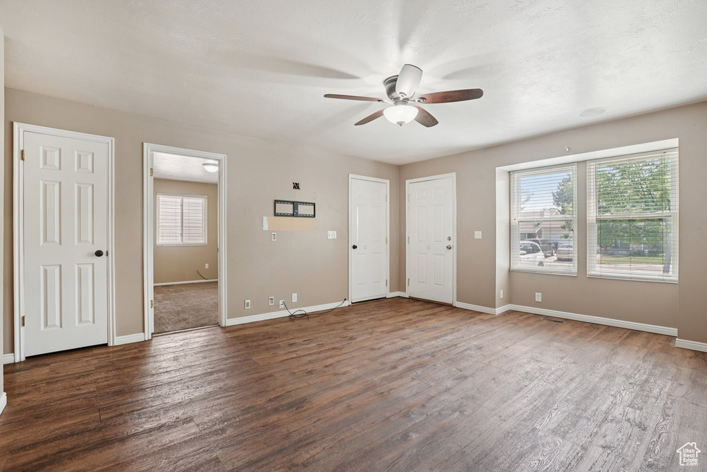 Foyer entrance featuring a ceiling fan and wood finished floors