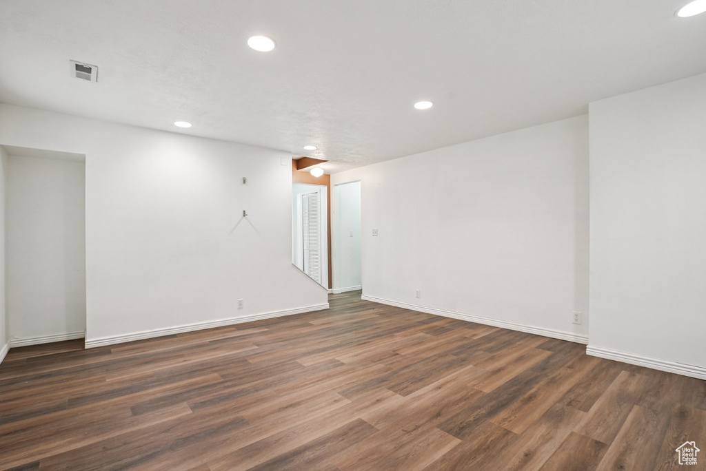 Spare room featuring recessed lighting and wood finished floors