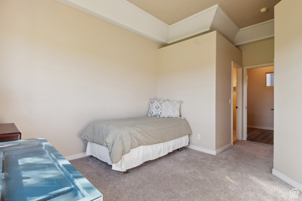Carpeted bedroom featuring baseboards