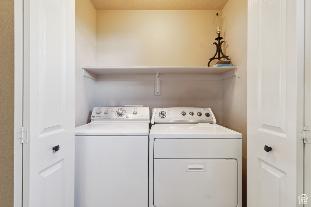 Laundry room featuring washer and clothes dryer