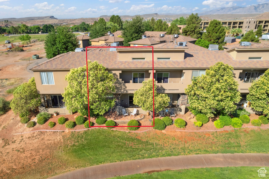 Aerial view of residential area featuring property parcel outlined and a mountainous background