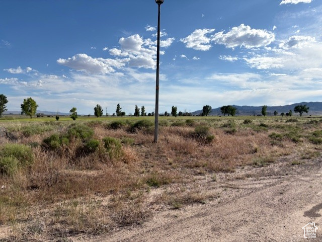 View of nature with rural landscape and a mountain backdrop