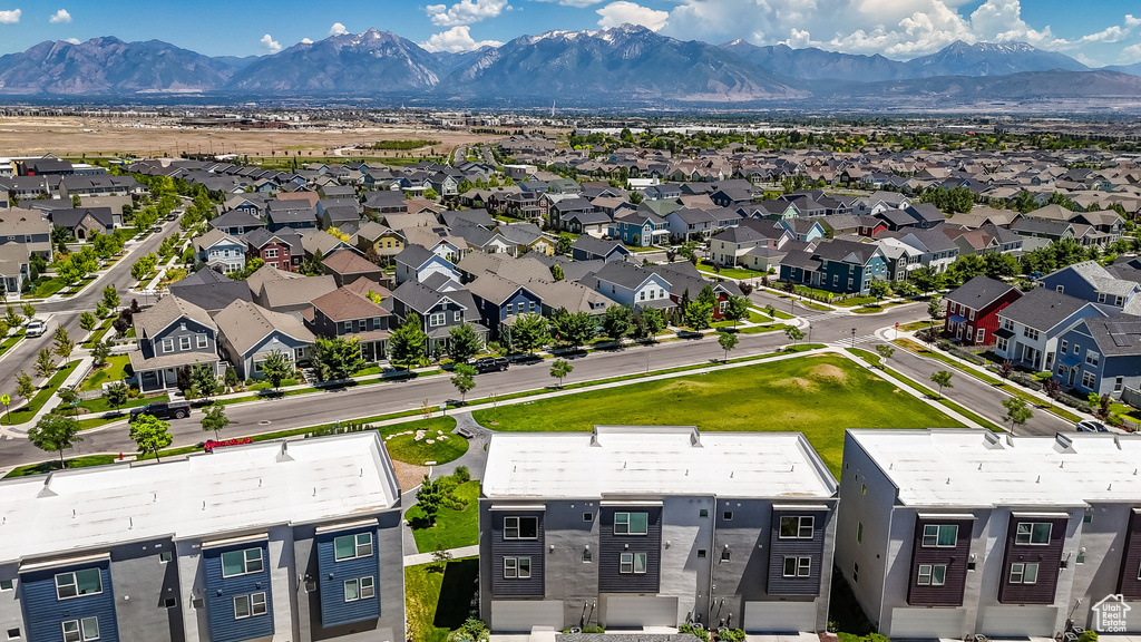Aerial perspective of suburban area with a mountainous background