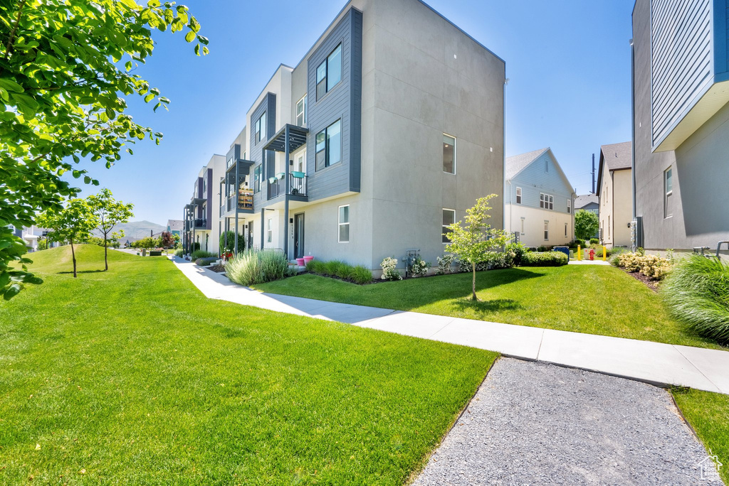 View of property with a residential view