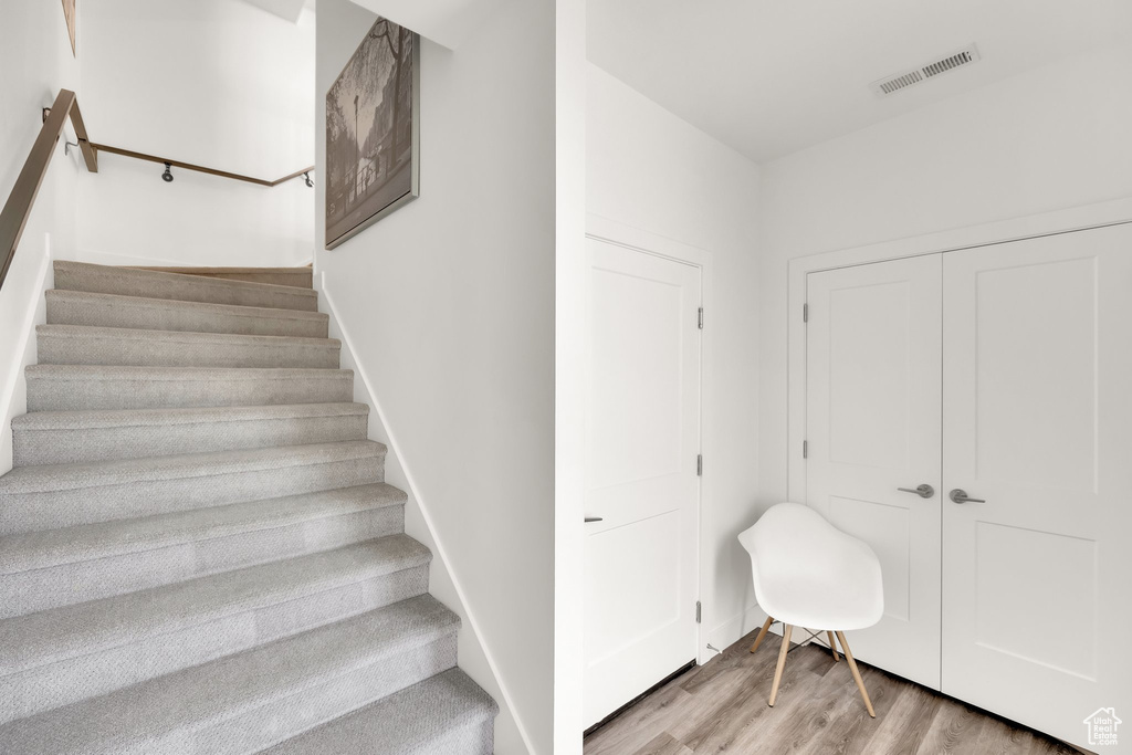 Stairway with wood finished floors