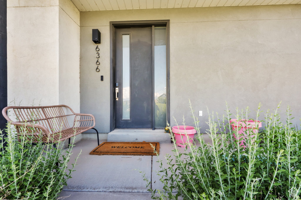 Property entrance with stucco siding