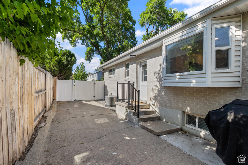 View of patio / terrace with a gate and a grill