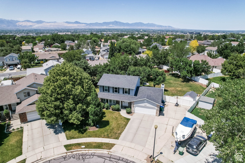 Aerial perspective of suburban area featuring a mountainous background