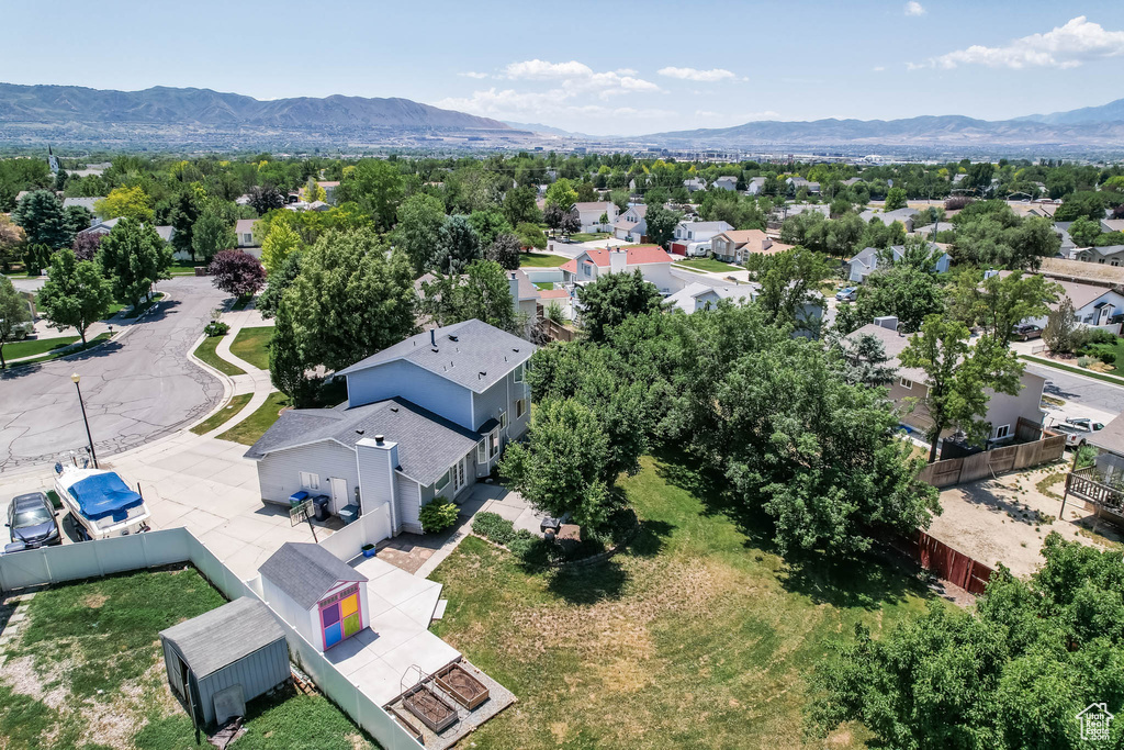 Aerial view of residential area featuring a mountainous background