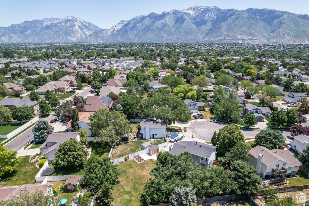 Aerial view of residential area featuring a mountain backdrop