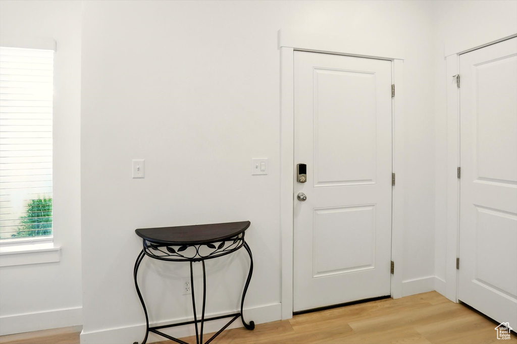 Entryway featuring light wood-style flooring and baseboards