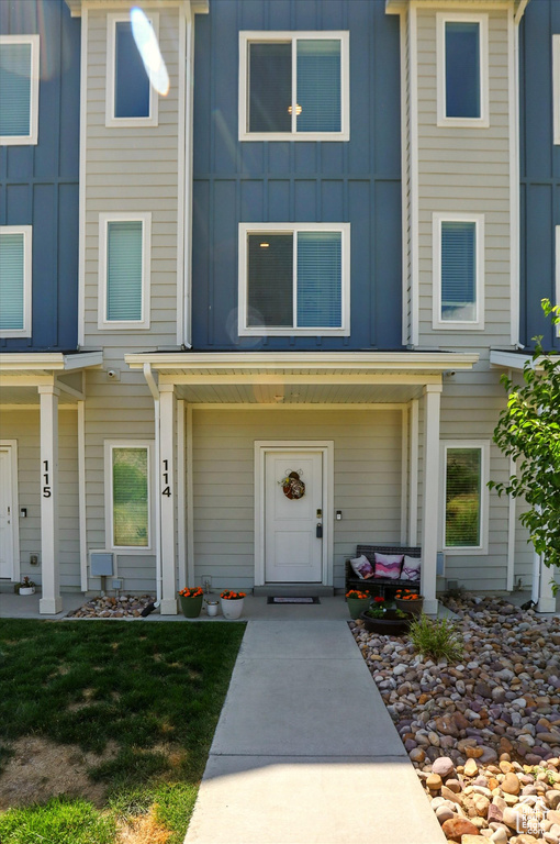 View of front of home featuring board and batten siding and a porch