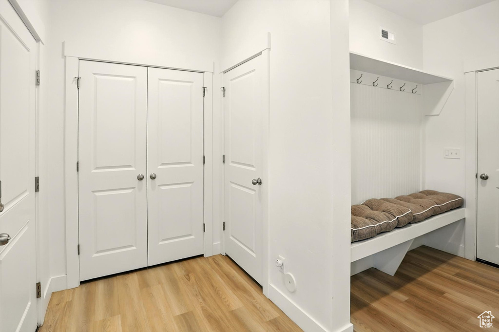 Mudroom with light wood finished floors