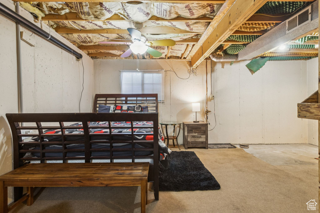 Below grade area with ceiling fan