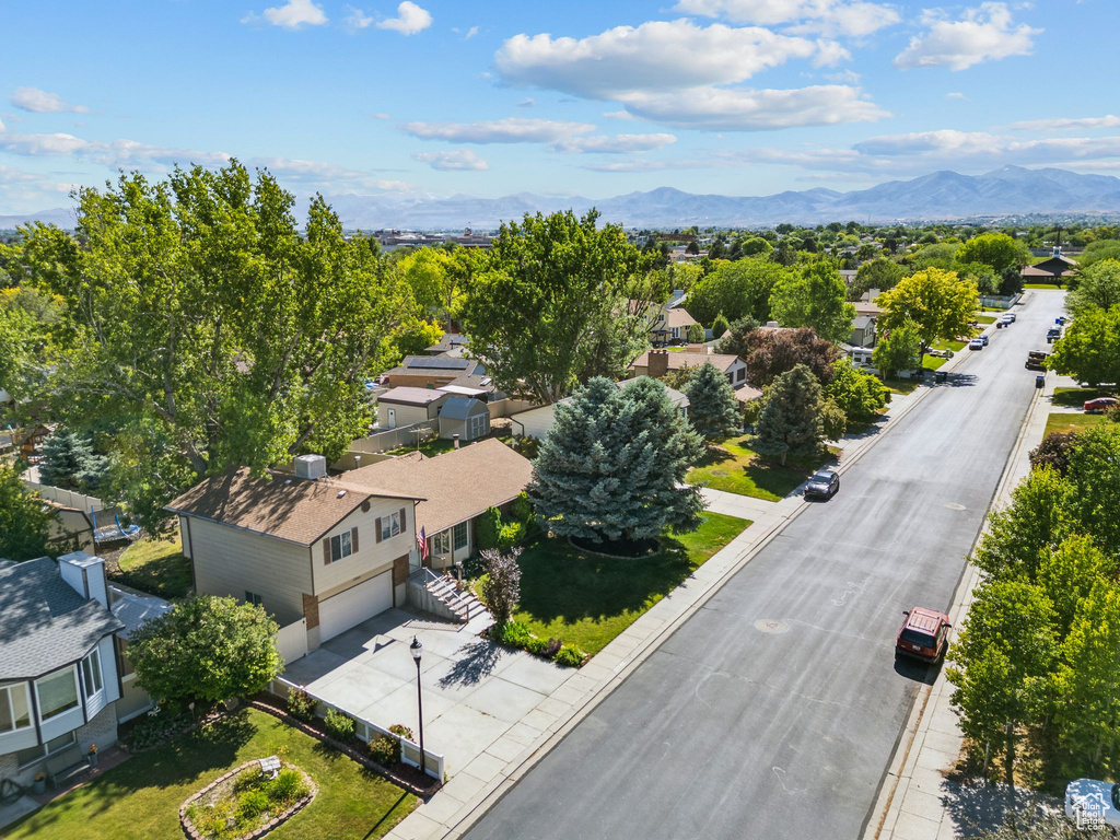 Aerial perspective of suburban area with a mountainous background