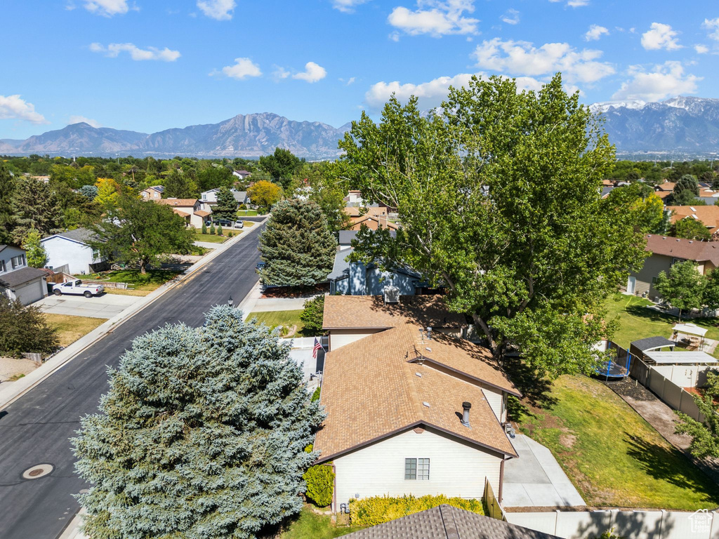 Aerial view of residential area featuring a mountain backdrop