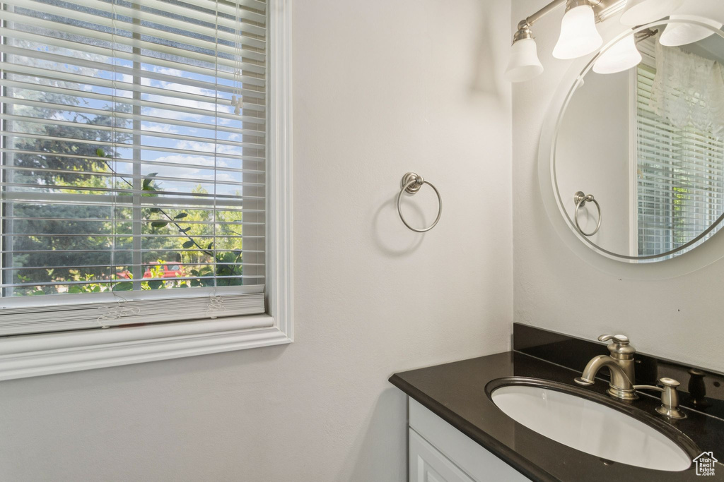 Bathroom with vanity and healthy amount of natural light