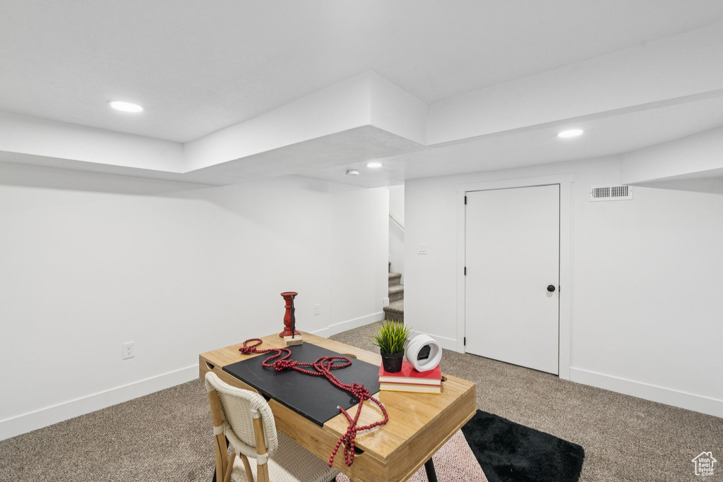 Carpeted home office featuring baseboards and recessed lighting