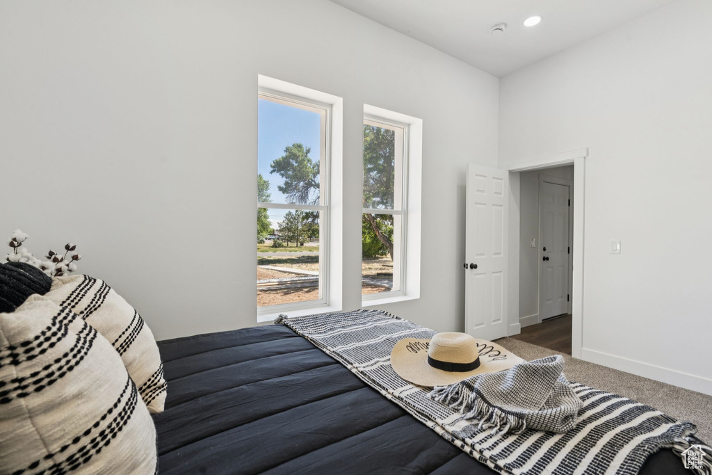 Bedroom with carpet and baseboards