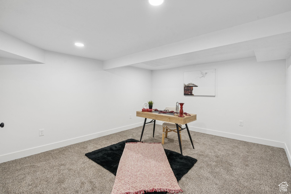Carpeted office space with baseboards and recessed lighting
