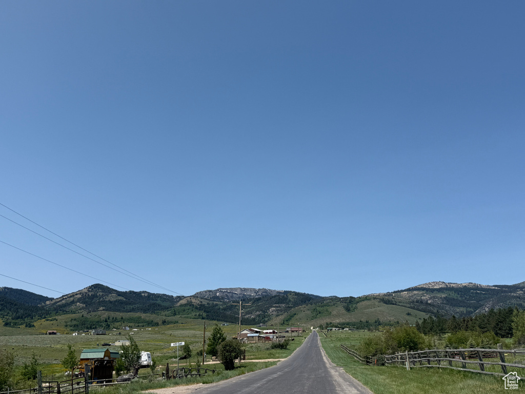 View of mountain backdrop with rural landscape