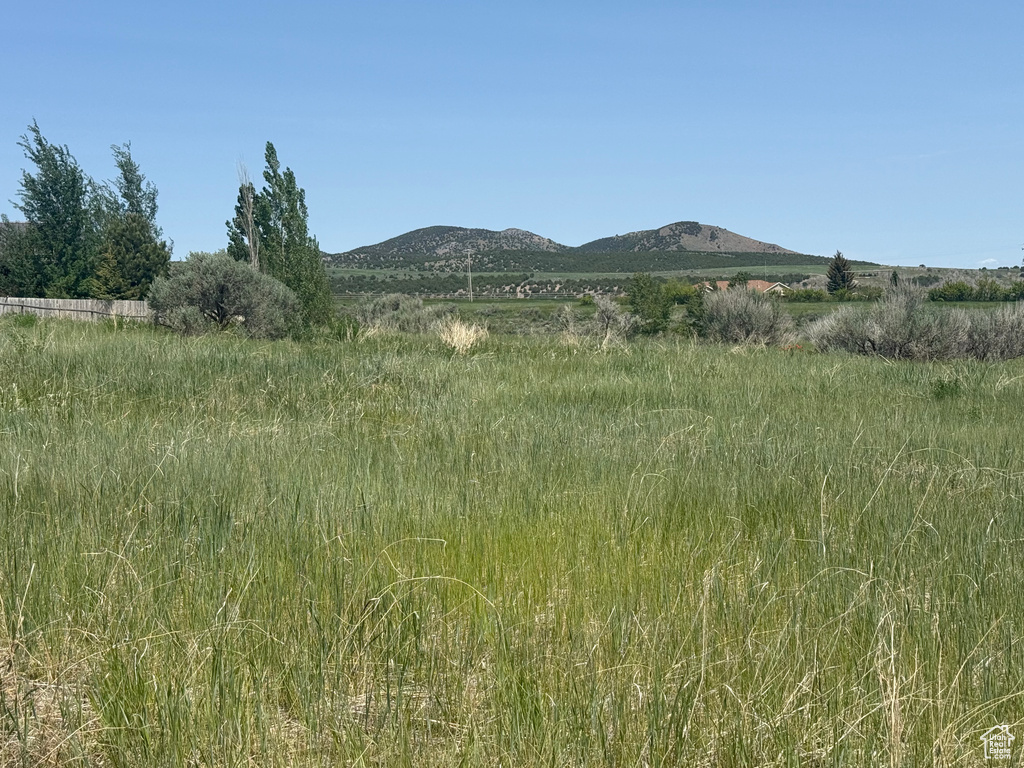 View of mountain backdrop featuring rural landscape