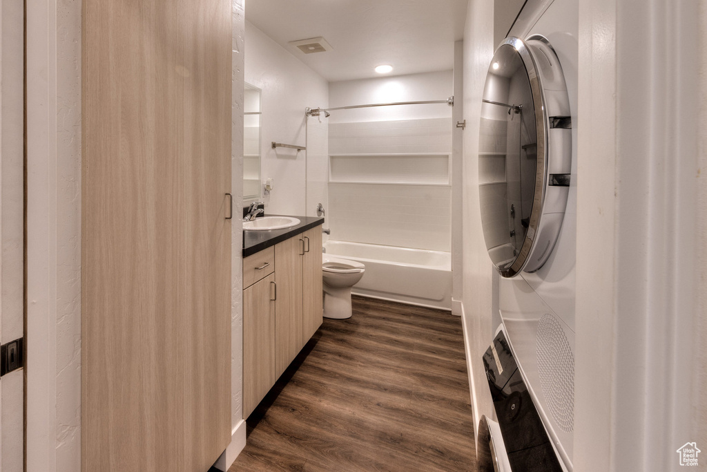Full bathroom featuring vanity, bathing tub / shower combination, and wood finished floors
