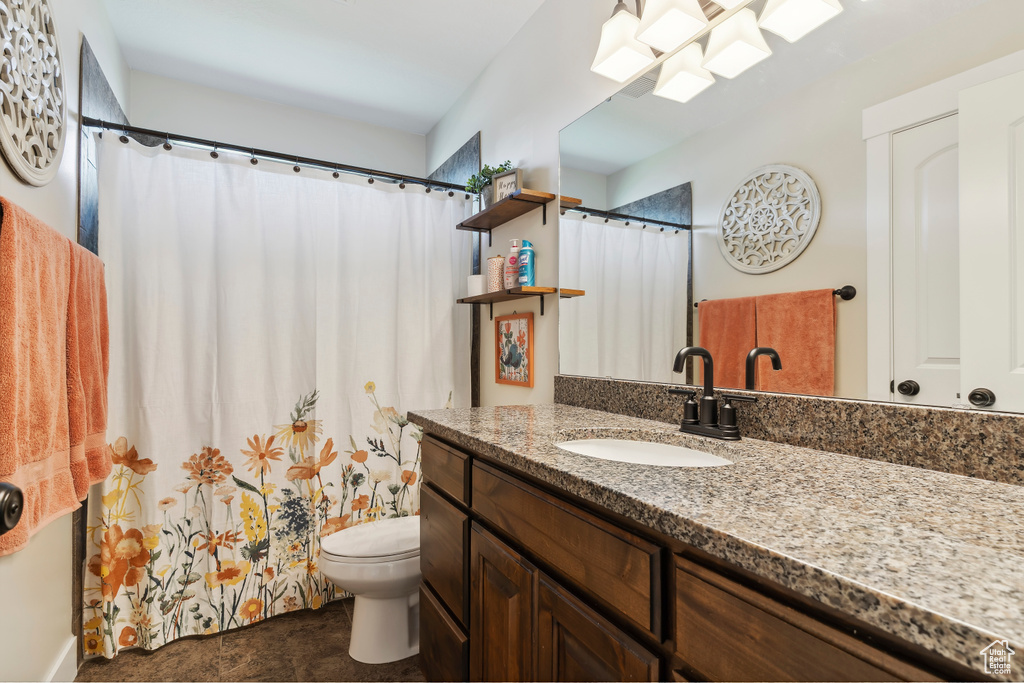 Full bathroom with vanity and curtained shower