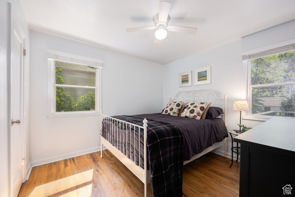Bedroom with light wood-type flooring and ceiling fan