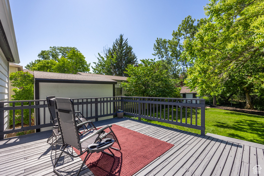 Wooden terrace with a yard