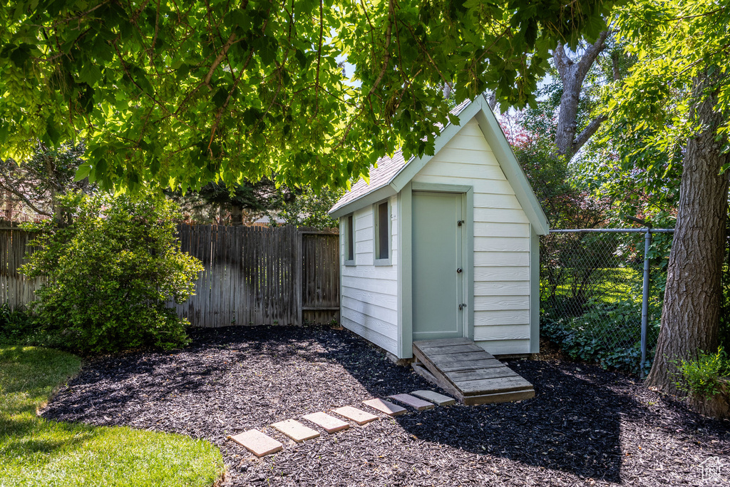 View of shed featuring a fenced backyard