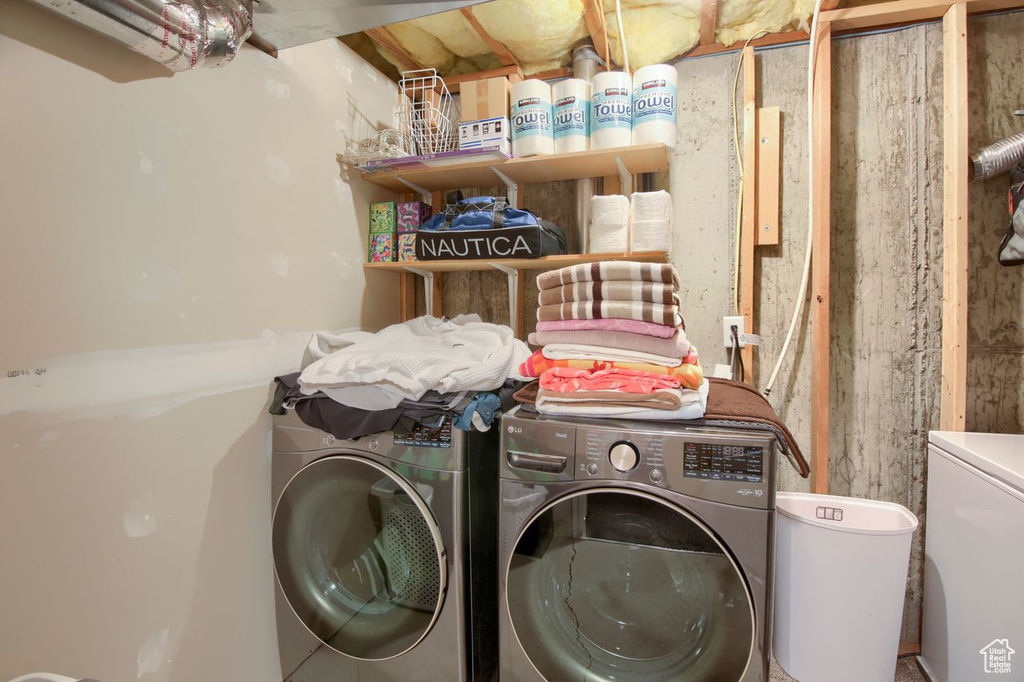 Washroom featuring washer and clothes dryer