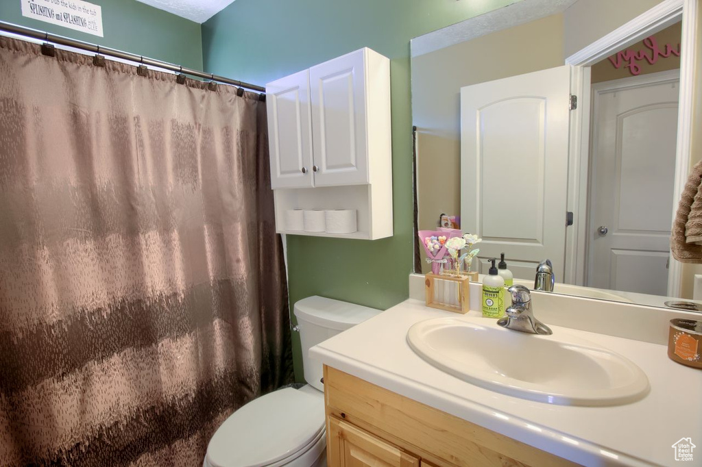 Bathroom with vanity and a shower with curtain
