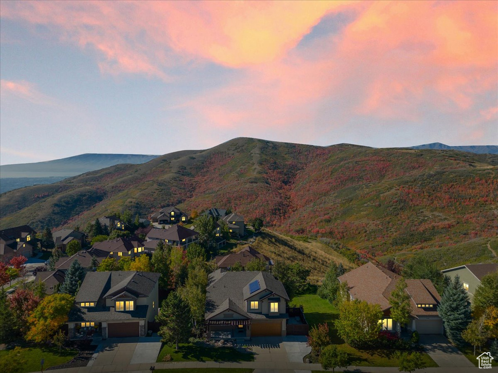Aerial perspective of suburban area featuring a mountainous background