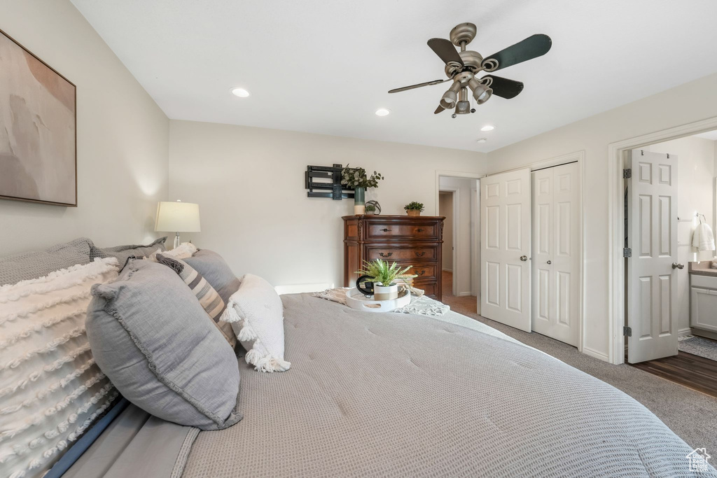 Carpeted bedroom with a closet, recessed lighting, and a ceiling fan